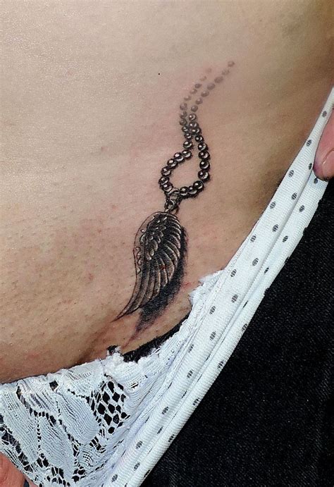 This is a female breast <b>tattoo</b> design with a combination of lines and dots, elevating the design beautifully. . Tatooed vagina